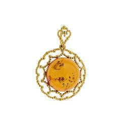 Silver pendant with amber