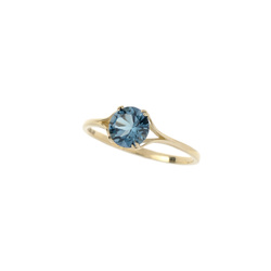 Gold ring with blue topaz